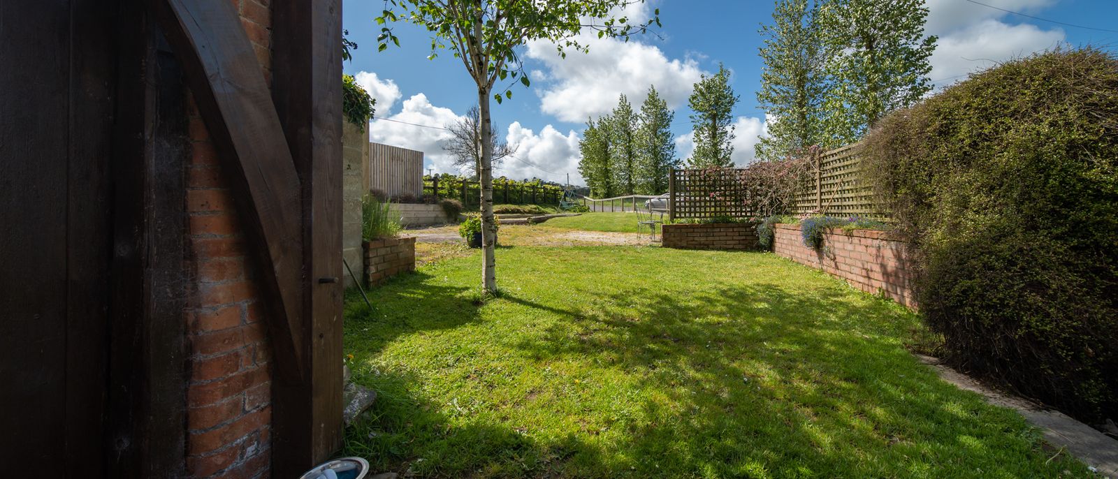 Large garden width secure fenced area for dogs